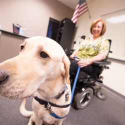Keith the service dog showed off his mad skills by handing a credit card to Linda Feld. The pair met with students on behalf of Canine Companions for Independence.