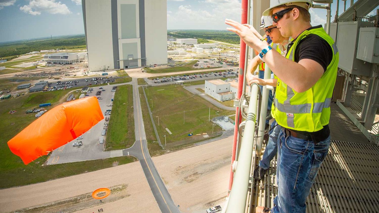 Engineering students test their parachute designs by dropping them from NASA’s Mobile Launcher platform at the Kennedy Space Center.