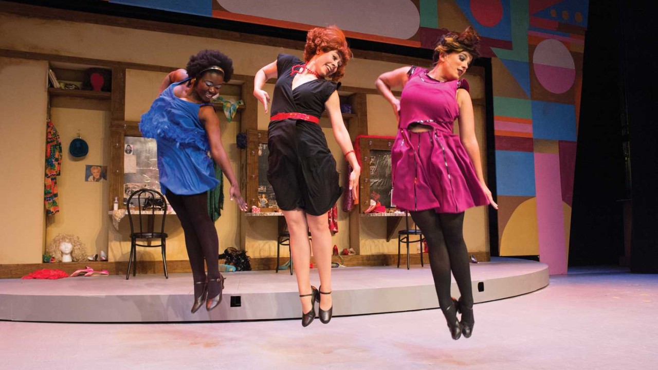 Performers practice their routine for the musical “Sweet Charity.”