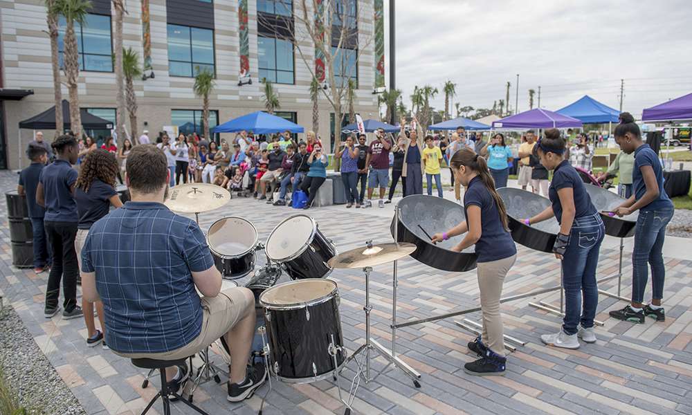 Poinciana Academy of Fine Arts students from the steel drum and dance department performs at the inaugural PoincianaFest held at Valencia’s newly-opened campus, Oct. 28.